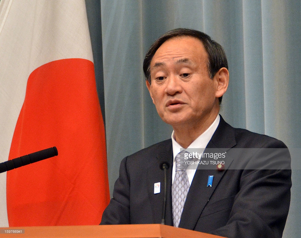 Japan top government spokesman Suga signals readiness to stem yen gains