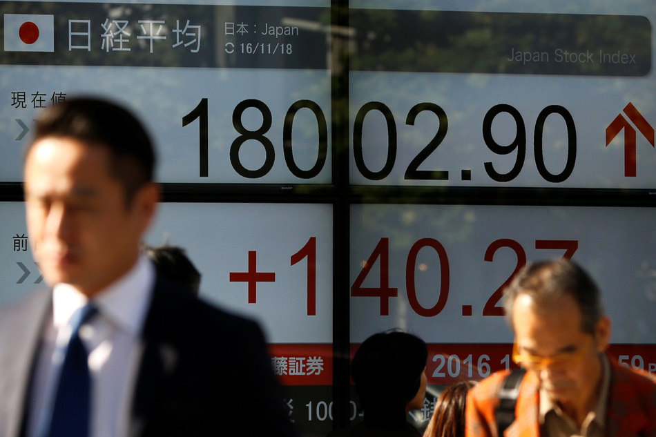 Asian stocks slip, Fed's decision day makes investors wary