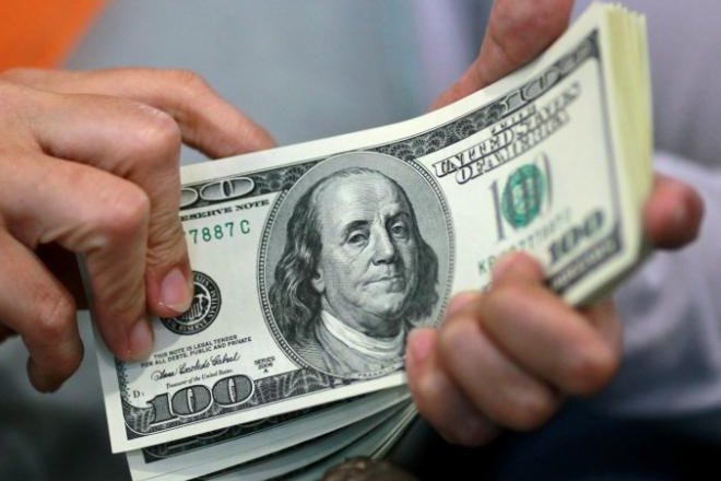 Dollar firm in Asia, resource shares on the run