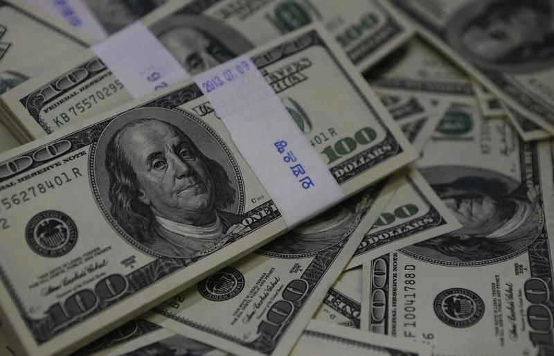 Dollar Falls, Treasuries Gain Amid Economic Data