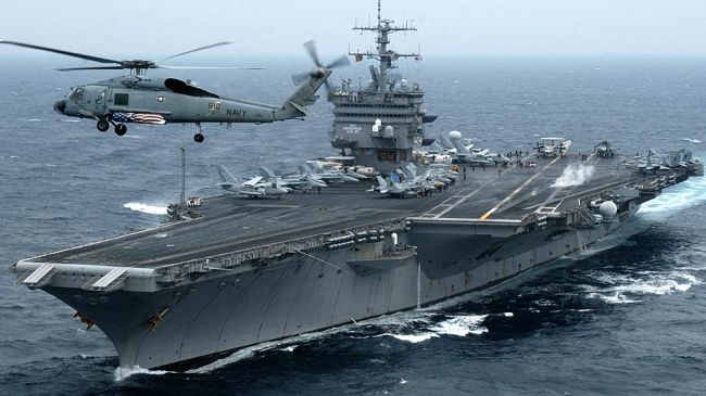 Iran denies harassing U.S. warships in Persian Gulf, warns of clashes