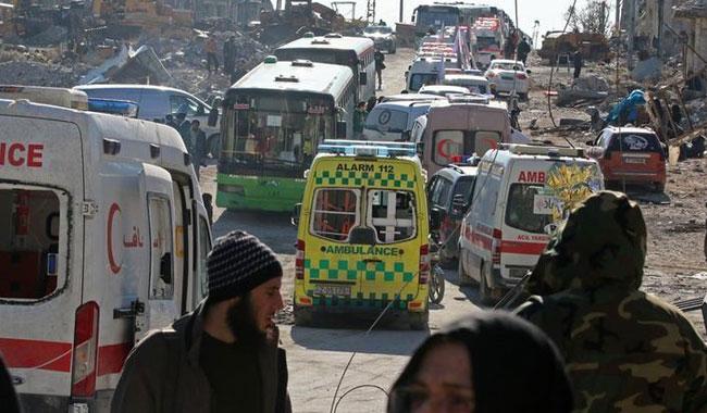 Buses evacuate thousands of exhausted Aleppo residents in ceasefire deal