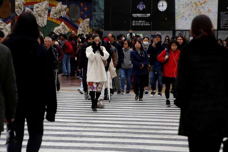 Japan government raises view on economy for first time since March 2015