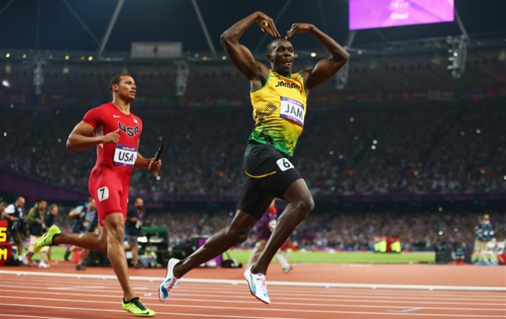 Unbeatable Bolt signs off with triple-triple
