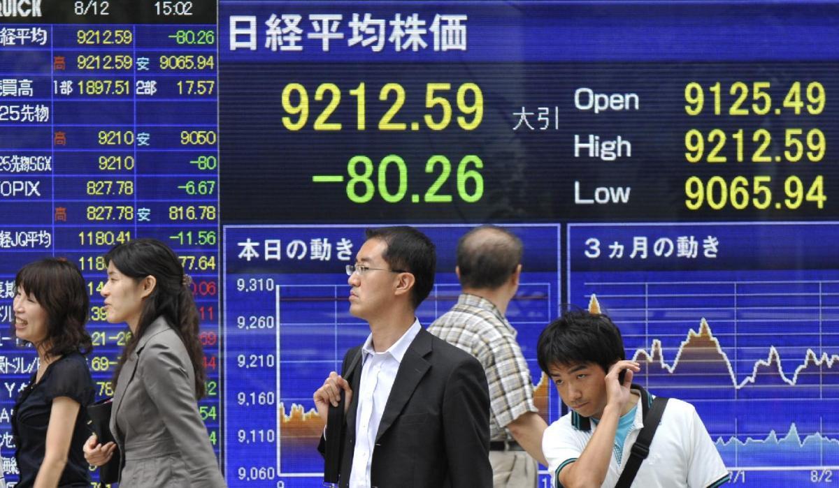 Asian shares mostly lower, oil near one-year high on output cut plan