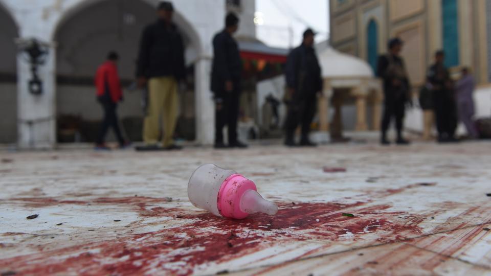 Pakistan says kills 100 'terrorists' after suicide shrine attack