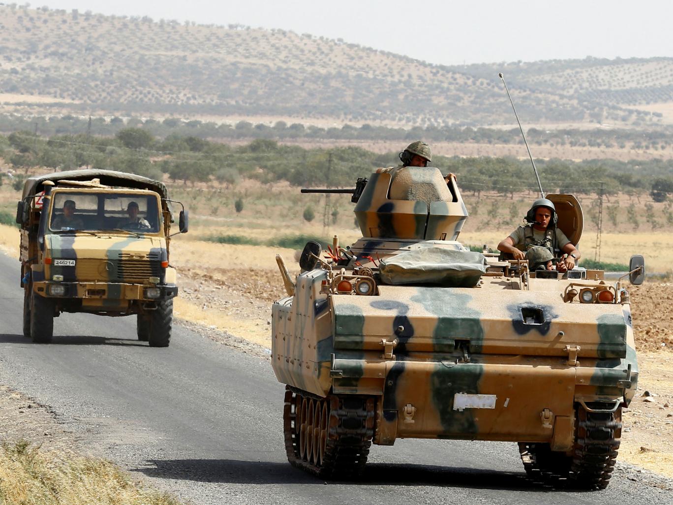 Turkish army thrusts deeper into Syria, monitor says 35 villagers killed