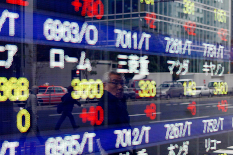 Strong dollar hits Asian share markets, oil surges