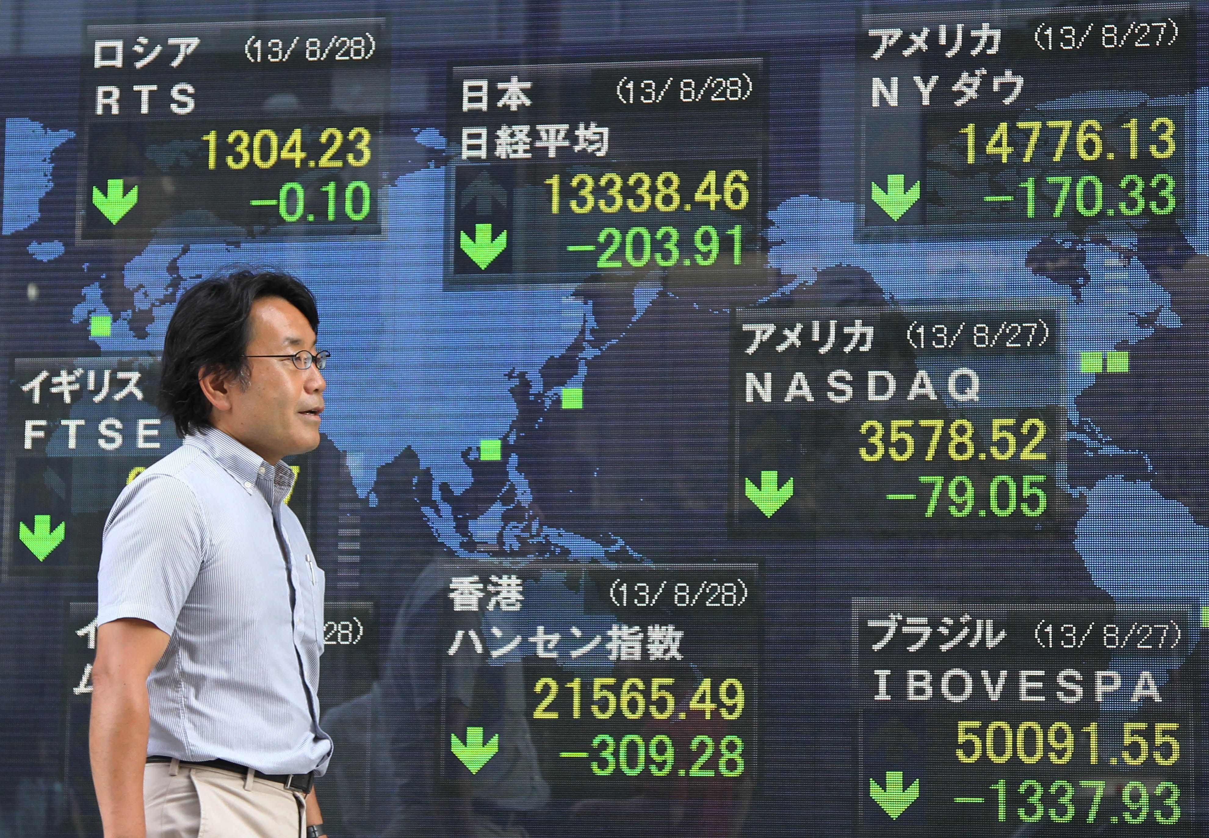 Asian stocks drop from one-year high, dollar rises on Fed rate comments
