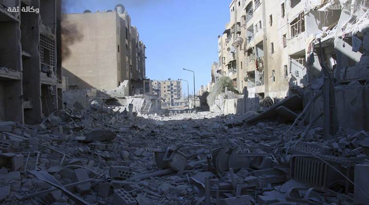 Syrian family, pupils among dozens killed in Aleppo attacks