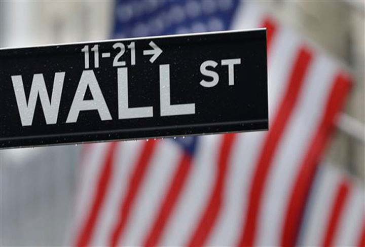 Wall St. slips as banks, discretionary stocks drag