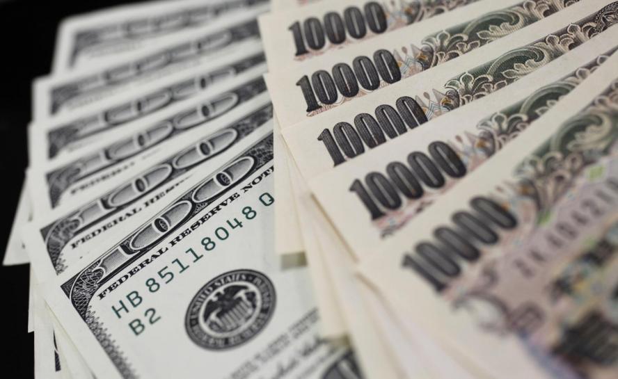 Dollar on defensive, hits one-month low vs yen