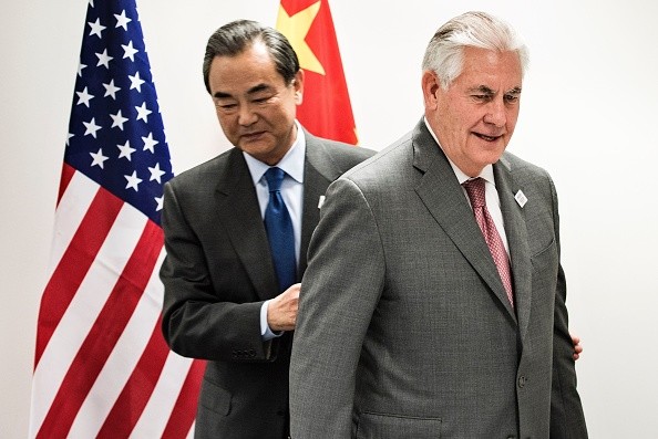 U.S., China soften tone, say to work together on North Korea