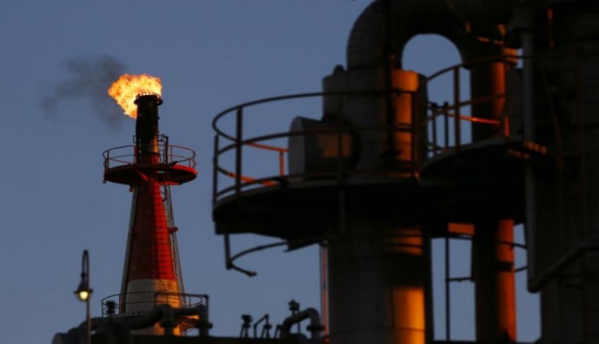 Oil prices inch down on high stocks, weak China factories survey