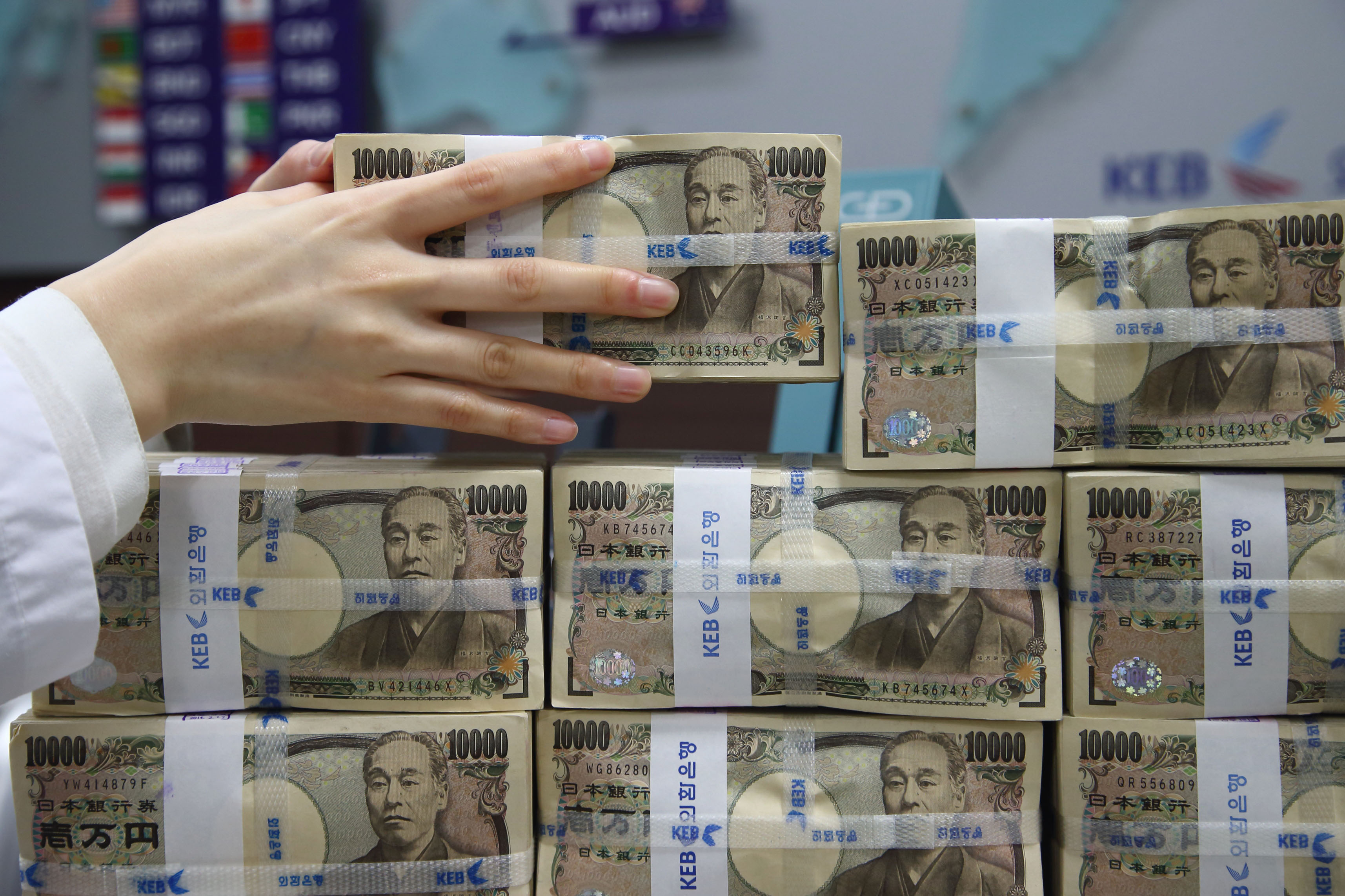 Japan's top FX diplomat signals readiness to intervene as yen spikes